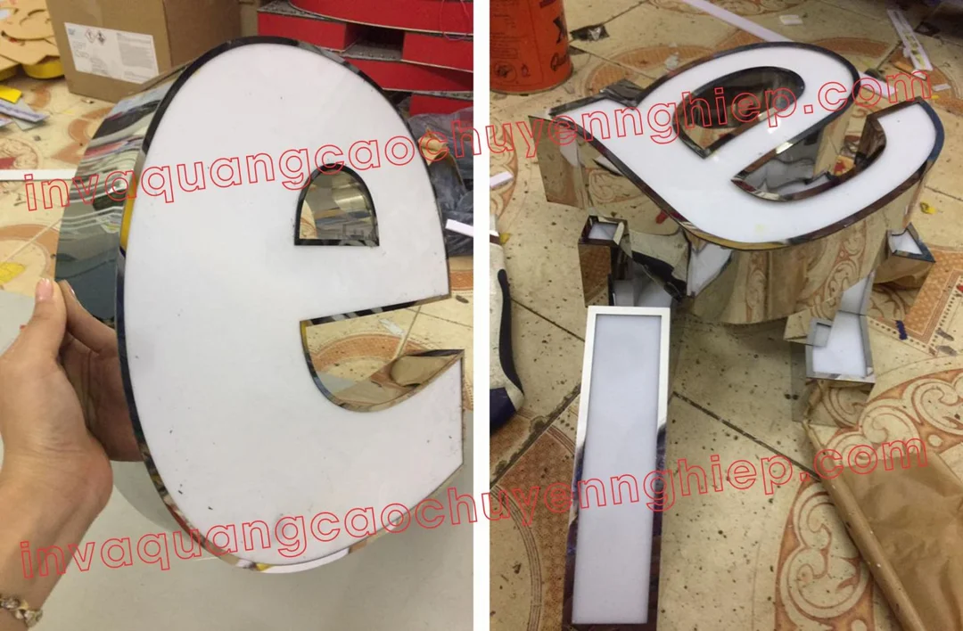 chữ nổi inox mica trên mặt dựng alu cho cửa hàng